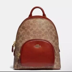 Coach Carrie Backpack 23 in signature coated canvas refined calf leather Used